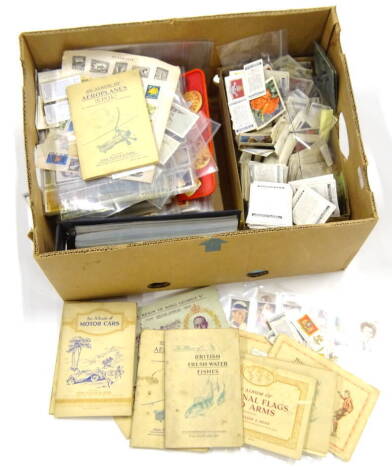 Various cigarette trade and other cards, a single Pluck famous football teams card Sunderland, various albums, Player & Sons Hints on Association Football, British Freshwater Fishes, National Flags & Arms, other loose cards, Olympic Challenge 1992, small 