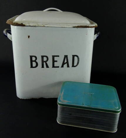 An early 20thC enamel bread bin, with domed lid and fixed handles, in blue, white and black, 32cm high, 35cm wide, 19cm deep, and a small quantity of other items.