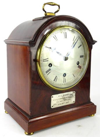 An early 20thC walnut and mahogany dome top bracket clock, the shaped case with gilt metal handle on compressed orb feet, fronted by a plaque G L Rose, Church Warden, Mickleham, 1927, with 16cm diameter Roman numeric dial, revealing a quarter striking key