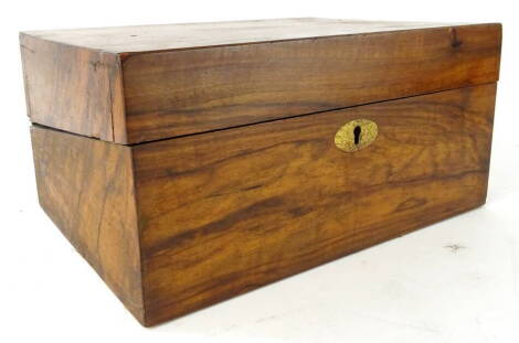 A 19thC walnut writing slope, of rectangular form, with oval escutcheon, 14cm high, 28cm wide, 19cm deep.