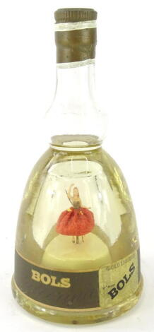 A vintage Bols musical liqueur bottle, set with dancing lady, of bell shaped form, apparently sealed and containing liquid, 25cm high.