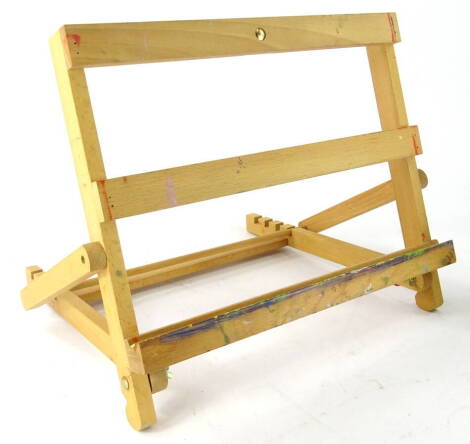 A beech table easel, with adjustable action, 45cm wide.