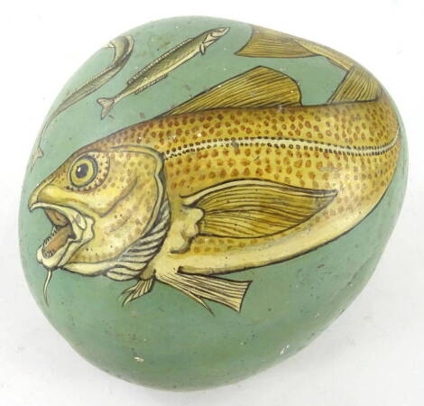 A painted rock decorated with pike and eel, on blue ground, 16cm wide.
