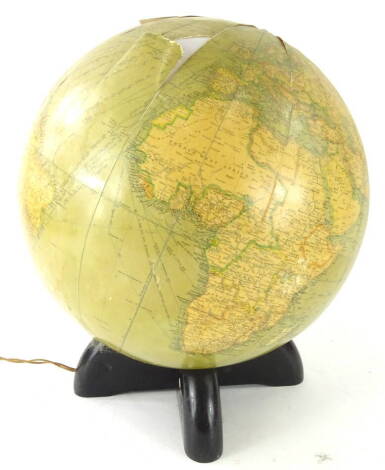 A 20thC Georama 12inch library globe, scale 1:42000000, with Asylum Road Peckham label, on an ebonised base, with electrical feature, 38cm high (AF).