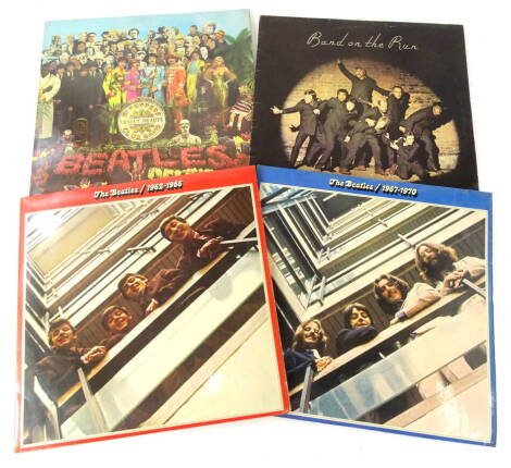 Records. The Beatles, Sgt. Peppers Lonely Hearts Club Band, Parlophone 33 1/3 stereo XEX 638-2 YEX 637 with cut outs, Paul McCartney & Wings Band on the Run, The Beatles Red Album and Blue Album.