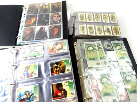 Various cigarette, trade and other cards, Lord of the Rings card collector's storage binder, a blue cigarette album containing various sets, Wills British Birds, Small Wonders, Gallaher, Carreras Raemakers War Cartoons, various other cigarette cards, bank