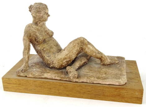 Ann Neimer (20thC). Reclining nude, clay sculpture, on wooden base, attributed beneath, 15cm high, 23cm wide, 10cm deep.
