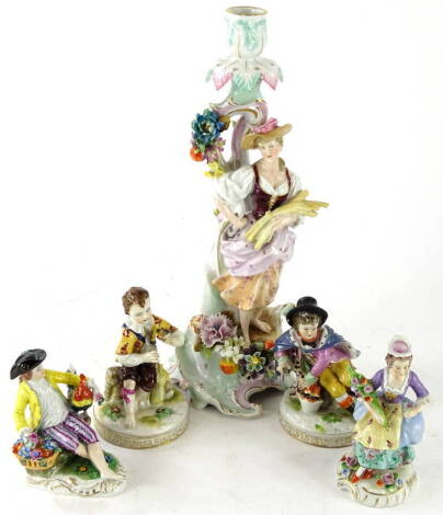 Various 20thC Sitzendorf figures etc., comprising a lady dressed in finery, holding a floral bouquet on a gilt lined ground, 'S' mark beneath, 14cm high, a figure of a gentleman, 'R' mark beneath, another of a figure aside a basket with Dresden marks, a f