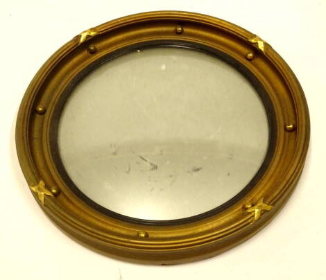 A 20thC port hole mirror, of circular form with bevelled glass and bead outline, with a moulded frame, 37cm diameter.