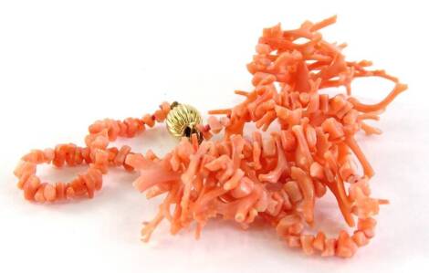 A graduated coral necklace, with a 9ct gold ball clasp.