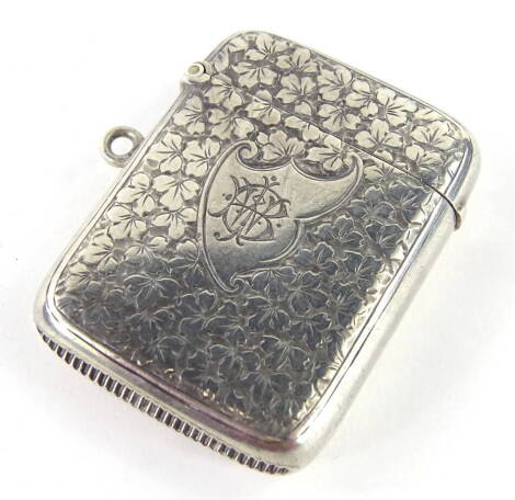 A Victorian silver Vesta case, of rounded form, partially engine turned with initial cartouche and match strike vase, Birmingham 1892, 5cm high, 1.26oz.