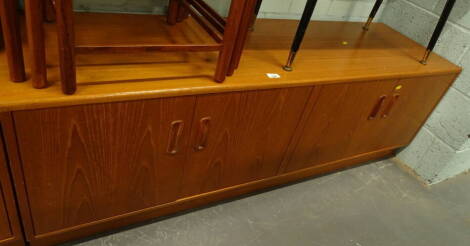 A 1970's vintage G Plan sideboard, of rectangular form, with double cupboards, on block base, 54cm high, 156cm wide, 47cm deep.