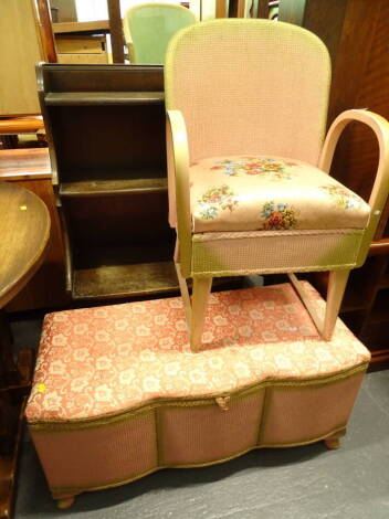 A Lloyd loom style lidded blanket box, with a serpentine front in peach, a similar design chair and a darkwood bookcase (3).