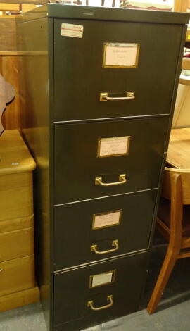 A four drawer metal filing cabinet, 134cm high, 47cm wide, 63cm deep and a lightwood chest of three long drawers.