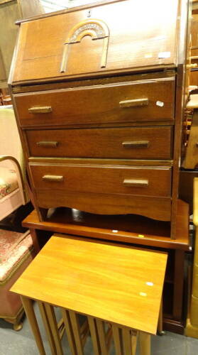 A mid 20thC oak bureau, 73cm wide, 42cm deep, (AF), a nest of lightwood tables and TV cabinet. (3, AF)