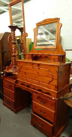 A harlequin pine bedroom suite, to include cheval mirror, dressing table mirror, blanket chest 49cm high, 90cm wide, 46cm deep, turned plant stand and a pedestal dressing table.