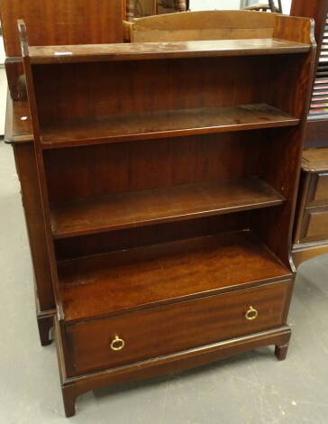 A Stag waterfall bookcase, with drawer beneath, 112cm high, 83cm wide, 34cm deep.