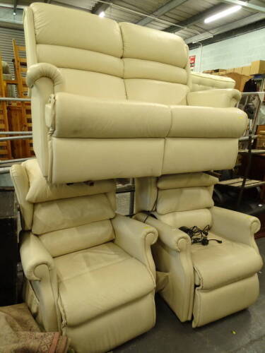 A three piece cream leather suite, comprising two seater settee, 144cm wide and two electric reclining armchairs (3).