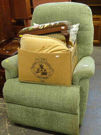 An electric reclining chair in green and black, check material, 106cm high, foot stool and various cushions.