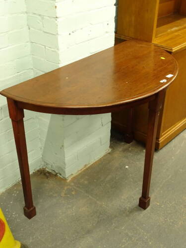 A demi lune side table, 75cm wide.