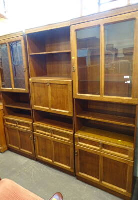 An oak display cabinet, in three sections, 186cm high, 185cm wide, 90cm deep.