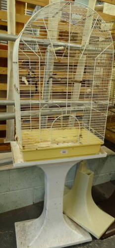 A meshwork dome topped bird cage on stand, 145cm high, 51cm wide, 28cm deep.