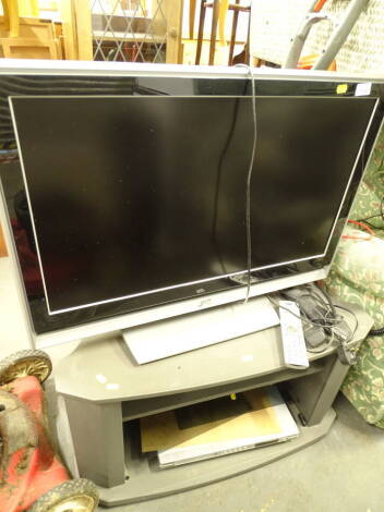 A JVC 31" colour television, model number LT-32DA8BJ, 220-240 volts, with remote control wire and stand, with other accessories.