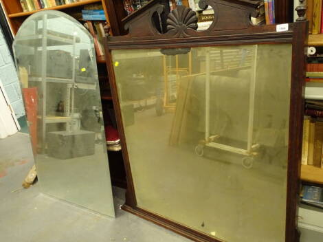 An early 20thC oak overmantel mirror with urn finials and bevel glass, in a moulded frame, 111cm high, 98cm wide, 60cm deep and a further curved mirror.