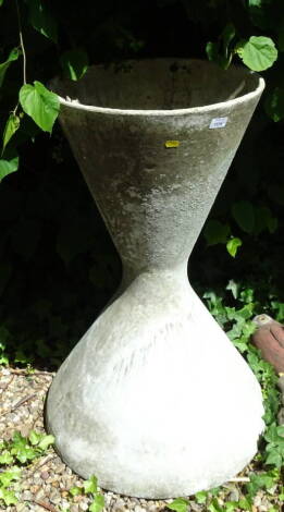 A concrete planter of waisted form, with shaped circular top, 94cm high, the top 47cm diameter.