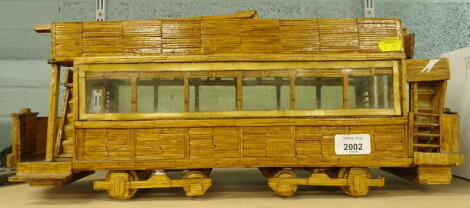 A scratch built tram, made from match sticks in the prisoner of war style, 21cm high.