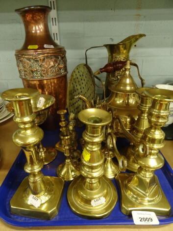 Brassware and metalware, early 20thC brass candlesticks, to include baluster examples, kettle, copper vase, with raised banding, brass jug, etc. (1 tray)