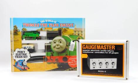 A Hornby World of Thomas the Tank Engine Percy OO-gauge set , Percy No.6 locomotive, rolling stock, R182, boxed, and a Gaugemaster Model Q four track transformer (2)