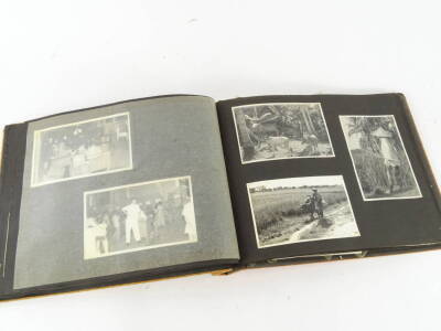 An early 20thC photograph album, showing black and white photographs of various figures in Singapore etc, some soldiers, a cabaret evening, 617 Squadron photographs showing aeroplane marked WH949, 11cm x 17cm, figure at the cockpit, various other black an - 3