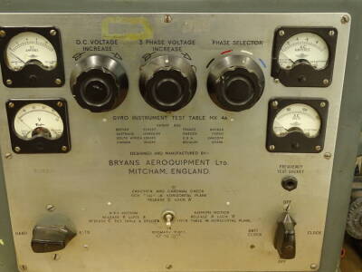 A Bryans Aeroquipment Gyro instrument test table, mark 4A, with central dial front knops and further dials for amps, direct current and so on, an Edwards & Co R3 motor, various other accessories, the main body 54cm high, 39cm wide, 42cm deep. - 2