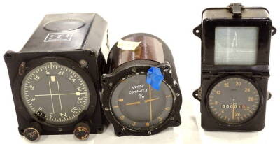 A GTEO magnetic compass, in metal case, with crows foot emblem, with set course and other front knops, 23cm wide, a further compass and a mileometer reading 10, each in metal casing (3).