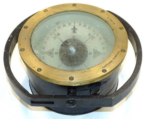 A 20thC metal cased compass, of circular form, with articulated inner dial, 17cm diameter.