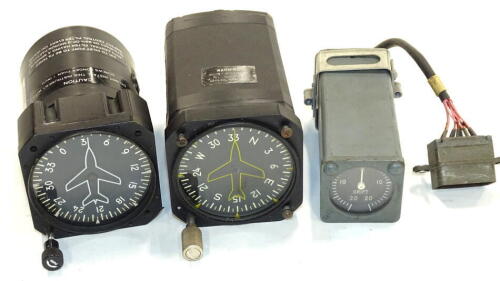 An aeroplane gauge compass, in metal case, 8cm wide and two various others (3).