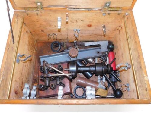 A tool box, containing various drill parts and sundry further tools.