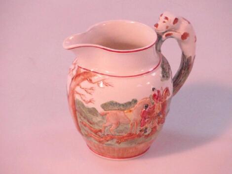 A Wedgwood relief moulded and hand painted hunting jug