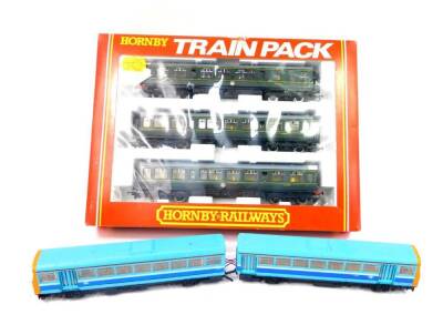 A Hornby OO-gauge Train Pack, BR three coach green livery diesel multiple unit Class 110, R369, boxed, and a BR Class 142 Twin Railbus Diesel Multiple Unit, DCC fitted. (2)