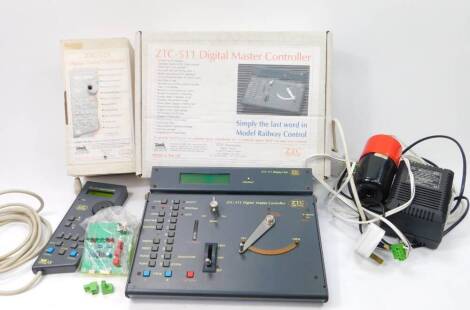 A ZTC 511 DCC Digital master controller, A ZTC 521 hand controller, transformer and capacitor, partially boxed. (4)