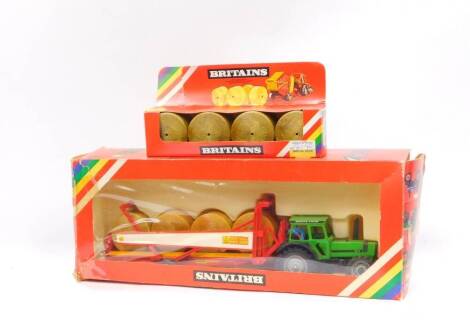 A Britains die cast Dautz-Fahr DX92 tractor with bale transporter, 9602, and a round bales set 1743, boxed. (2)