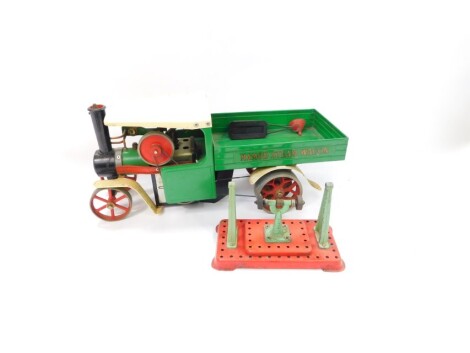 A Mamod steam engine open backed truck, with tipper action, in green, black, red and cream, 21cm high.