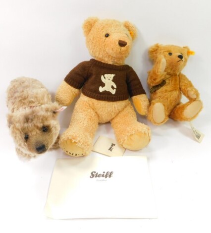 A Steiff Cosy Year plush jointed teddy bear, 663130, 2009, with brown knitted sweater, stitched to under foot with label to the ear, 40cm high, a modern Steiff bear, another Anniversary USA 66037 1902-2002 Centenary, with metal stud to the ear, some paper