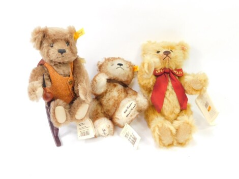 A Steiff Grandpa bear, 654527, in rocking chair, 29cm high, a plush jointed Scorpio bear 654947 with Scorpio medallion to the neck and an 1880-2005 Steiff anniversary bear with label (3)