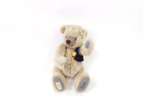 A Dean's Rag Book plush jointed teddy bear, Old Fathertime, in grey, stitched and labelled under foot, with spectacles to the head, 32cm high.