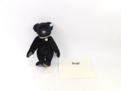 A Steiff Swarovski bear Krystina exclusive for the Danbury Mint, in black, with growl action, elaborate heart collar and rhinestone style stitching under foot, with paperwork, 28cm high