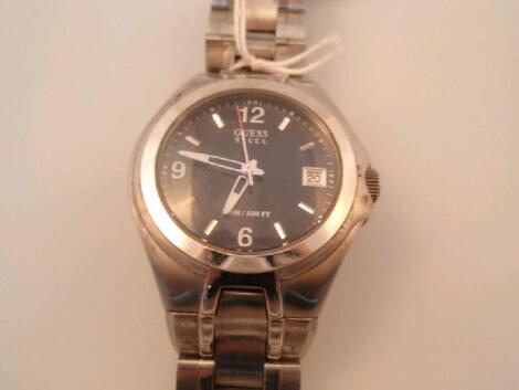 A gentleman's Guess stainless steel wristwatch