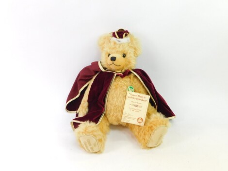 A Hermann Celebration Queen Mary II limited edition plush jointed teddy bear, number 221/950, wearing red cloak, stitched to underside of feet, 41cm high.