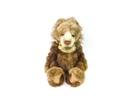 A Charlie Bears Graeme plush jointed teddy bear, CB104698, with bell collar, 51cm high and an associated bag.